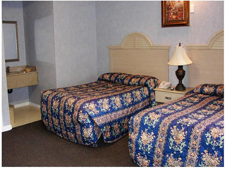 Village Inn & Suites - Smithville Phòng bức ảnh